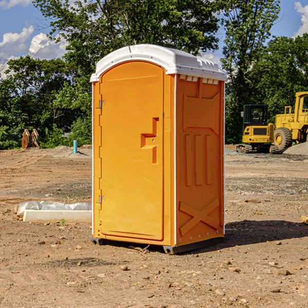 what is the cost difference between standard and deluxe portable toilet rentals in Manville